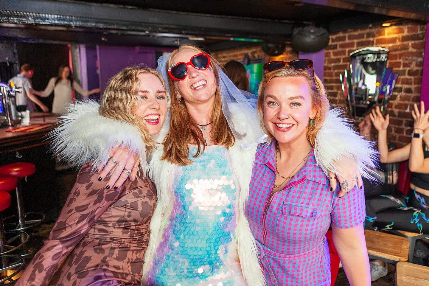 Friends dressed up and celebrating at Qwerky Drag Brunch