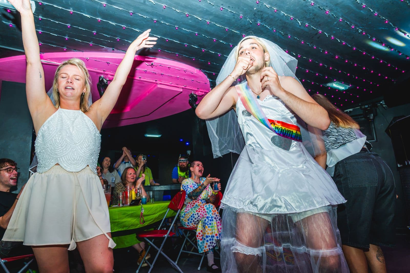 Two brides-to-be dancing at a Qwerky drag brunch at Legends
